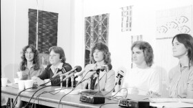 Dixon Press Conference 1982: (Left to Right) Kim McAlister (CWSS), Robin Bruce, Fran Ledford, Chris Russell and Eileen Bingle looking at audience.