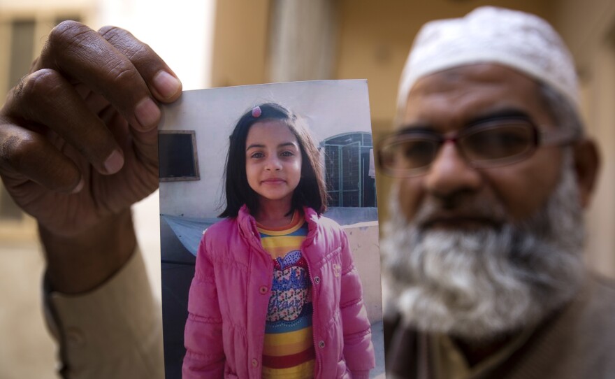 Mohammed Amin shows a picture of his 7-year-old daughter, Zainab Ansari, in Kasur, Pakistan, on Jan. 18. On Saturday, a 24-year-old local man, found guilty in her murder, was sentenced to die.