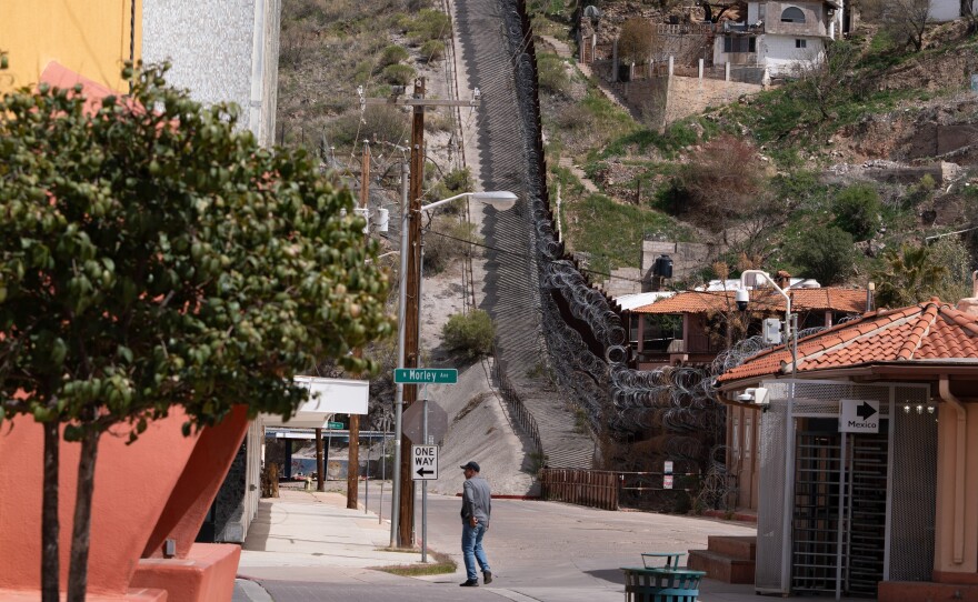 A man walks by downtown Nogales in Arizona, across the border from Mexico.