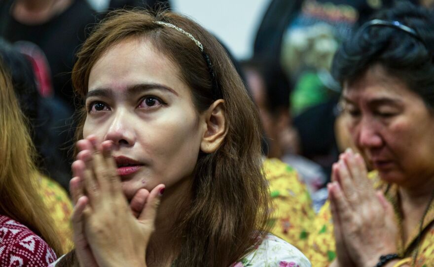 Indonesians from different religious groups take part in a joint prayer for the victims of a bomb attack on a church in Surabaya earlier this month.