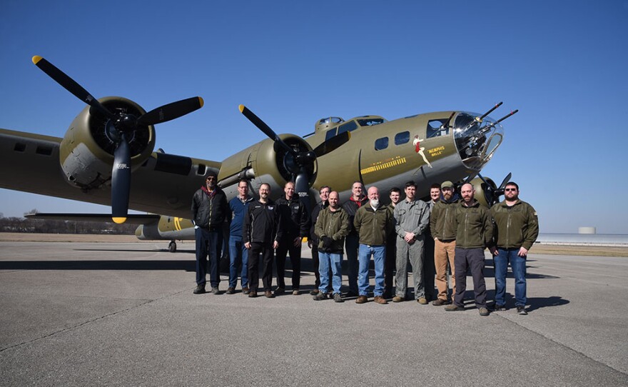 The restoration team gathered in front of the renewed Memphis Belle