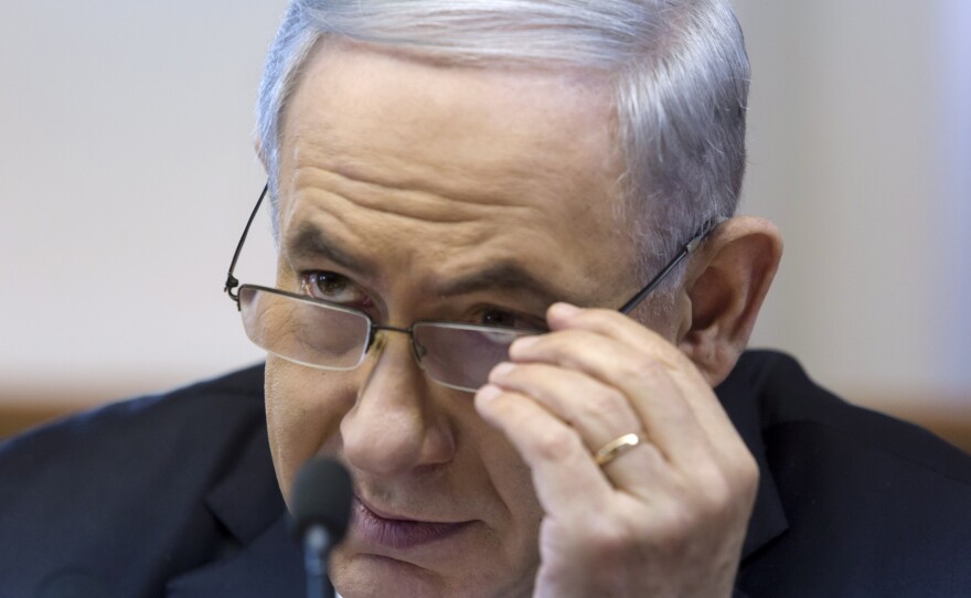 Israeli Prime Minister Benjamin Netanyahu listens during a Cabinet meeting in Jerusalem on Sunday. His Cabinet approved a draft law that defines the country as "the nation-state of the Jewish people."