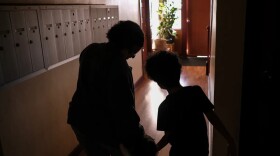 Loreal Duran walks with her children, ages one and seven, through the hallways of her apartment complex in Los Angeles on Feb. 8, 2025. Loreal’s husband Giovanni Duran, born in El Salvador, was detained by U.S. Immigration and Customs Enforcement agents as part of nationwide agency operations in January.