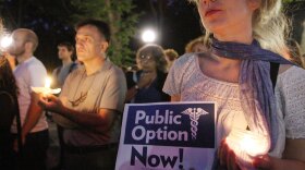 Demonstrators participate in a vigil to support a public health insurance option, last September in New York.