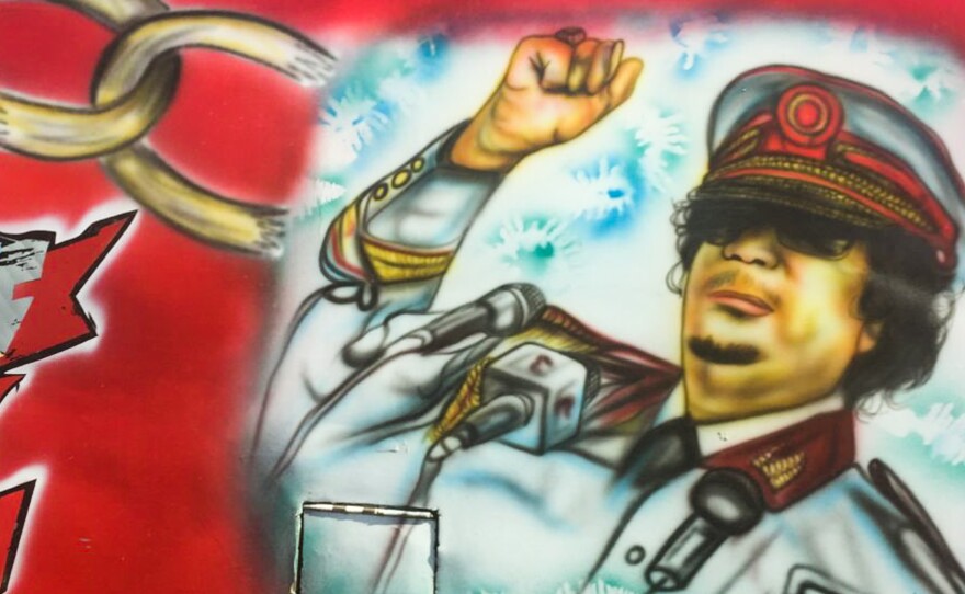 Yes, that is the late Libyan leader Moammar Ghadafi. On a bus. In Nairobi.