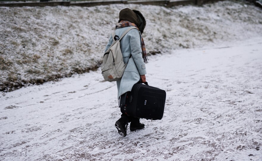 A Ukrainian refugee on their way to Poland.