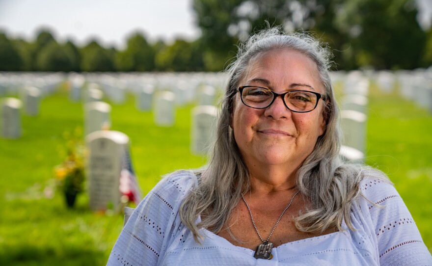 Teresa Greniger, the mother of LCpl. Robert Greniger, visiting his grave.