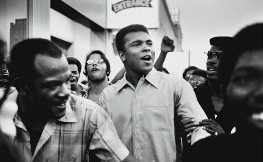 Muhammad Ali walks through the streets of New York City with members of the Black Panther Party, Sept. 1970.