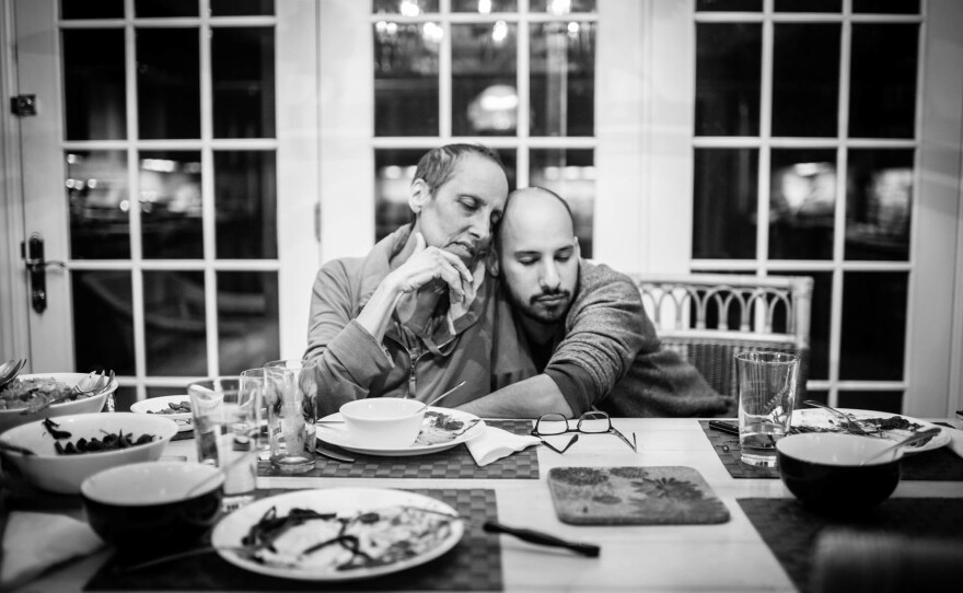 Mom eats dinner with us kids, featuring her famous eggplant parmigiana recipe prepared by her son Matthew. This would be the last meal she would eat.