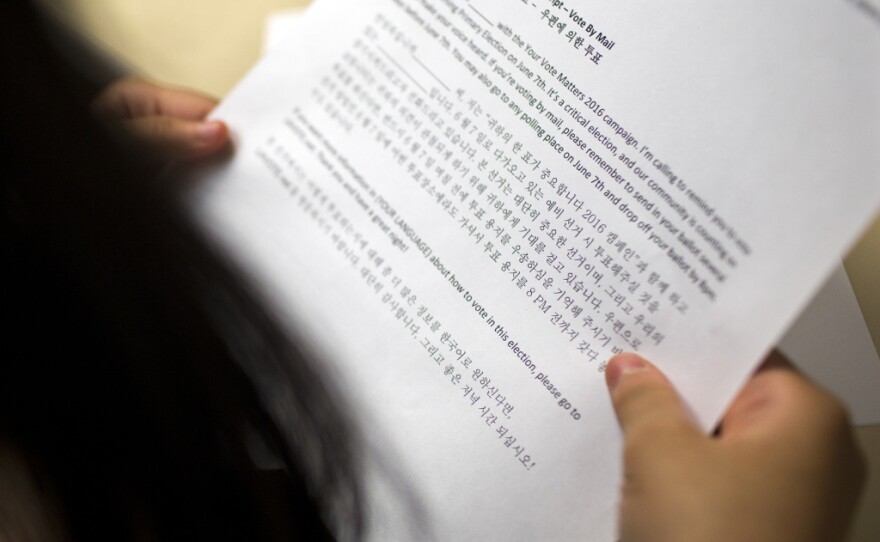 A student from the Los Angeles Center for Enriched Studies looks at a Korean call script during a phone bank shift reminding people to vote in the upcoming primary election at the Asian Americans Advancing Justice Los Angeles on Monday evening, May 23, 2016. The center works in partnership with 20 different organizations to run the phone bank.