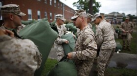 Marines prepare for deployment as part of the 2nd Marine Expeditionary Brigade, the first major deployment of U.S. Marines into southern Afghanistan.