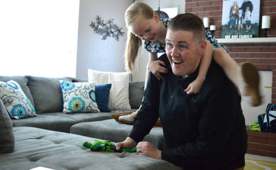Nick Emery plays around with his oldest daughter Nevaeh, 8, at their Carson City home in this undated photo. 