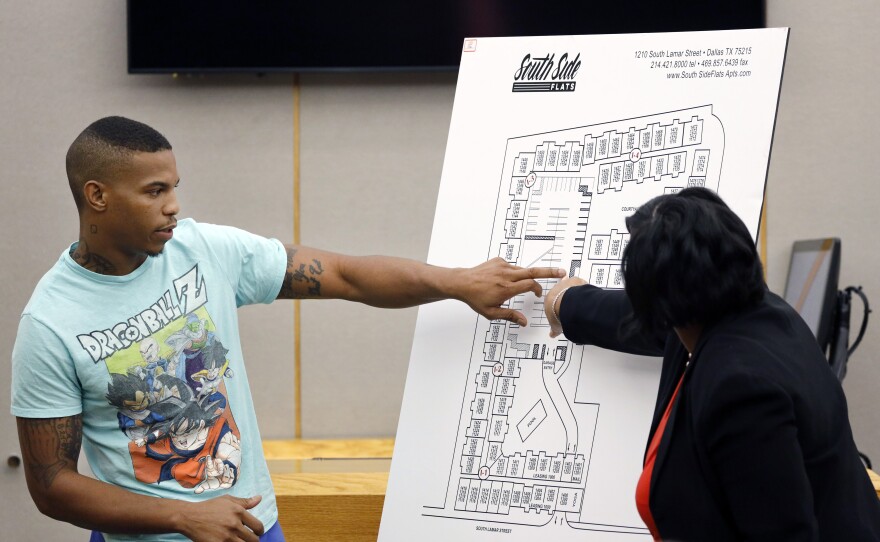 Joshua Brown answers questions from prosecutors while pointing to a map of the South Side Flats apartment complex during the murder trial of former Dallas police officer Amber Guyger. Ten days after his testimony, Brown was found shot to death.