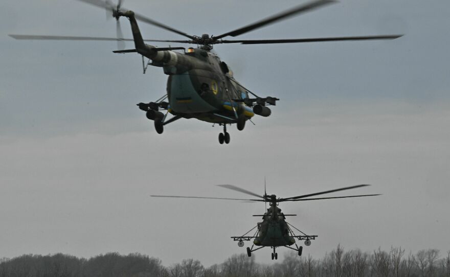 Ukrainian military MI-8 helicopters fly at a low altitude in the Kharkiv region on April 2, 2023, amid the Russian invasion of Ukraine. Maksim Kuzminov, a Russian army defector who is suspected of being the person found dead in Spain, flew such military helicopters.