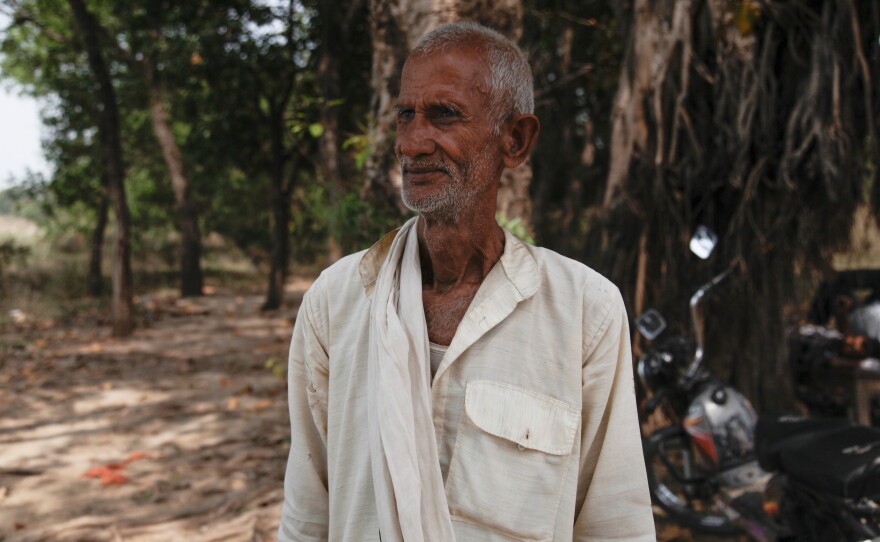 A man named Shivanandum poses for an image by the Ganges River in the town of Chausa. He conducts the last rites for Hindus before their bodies are cremated by the riverbank, their ashes submerged in the Ganges.