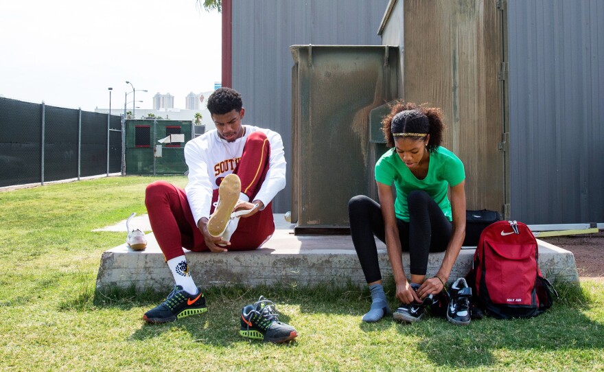 (Top Left) Vashti Cunningham warms up as father Randall Cunningham prepares for practice at the University of Nevada Las Vegas's Sheila Tarr Track. (Top Right) Randall Cunningham watches son Randall Cunningham Jr. practice the high jump. (Bottom) Siblings Randall and Vashti Cunningham lace up prior to practice with their father.