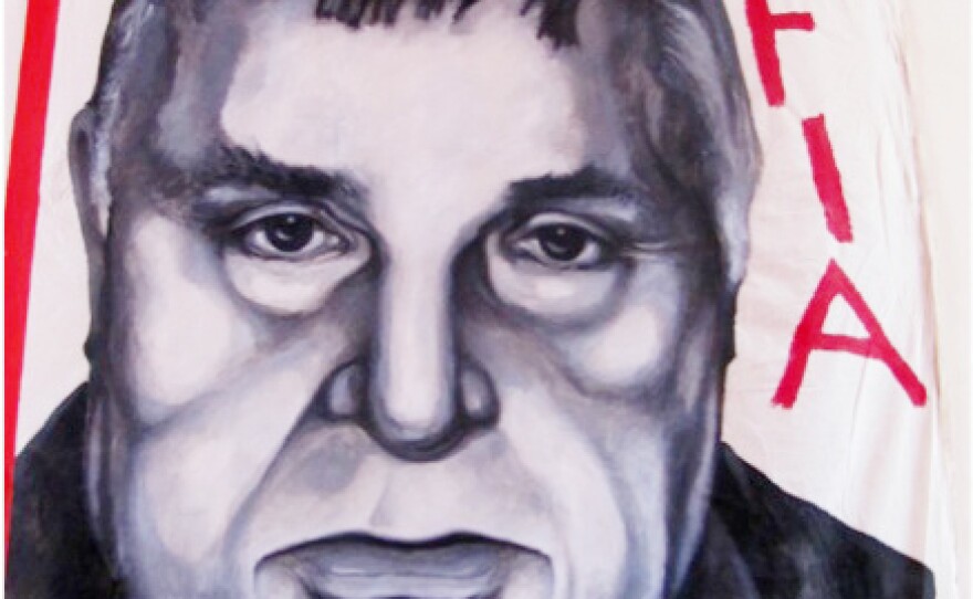 A painting of Mafia boss Salvatore Riina, on display at the Museo Anti-Mafia in Corleone, Sicily.