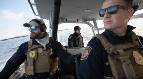 From right, Supervisory Marine Interdiction Agent Evan Wagley, Deputy Directory Reif Smith, and Agent Kurt Nagel, ride on a Customs and Border Protection Air and Marine Operations boat off the coast of San Diego, Nov. 30, 2022.