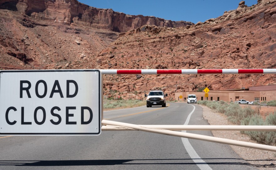 The gate to Arches National Park is closed on a weekday morning last month, as it is many mornings after the parking lots and trails quickly fill up.