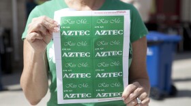 This woman handed out stickers celebrating both the Aztecs and St. Patrick's Day. 