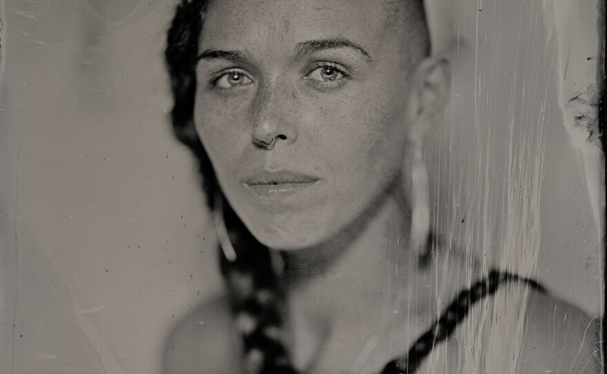 The work of Kali Spitzer (Kaska Dena & Jewish) embraces the stories of BIPOC, queer and trans people, creating representations that are self-determined. This traditional tintype photo of Larissa Lorraine Grieves (Nisga'a, Gitxsan, Cree, Blackfoot from the Pikuni Nation, Metis, Swedish, Irish and Scottish) was made in 2021.