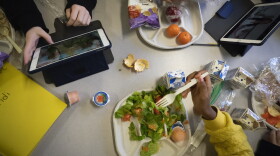 Seventh-graders sit together in the cafeteria during their lunch break at a public school in Brooklyn, N.Y., on Feb. 10, 2023.