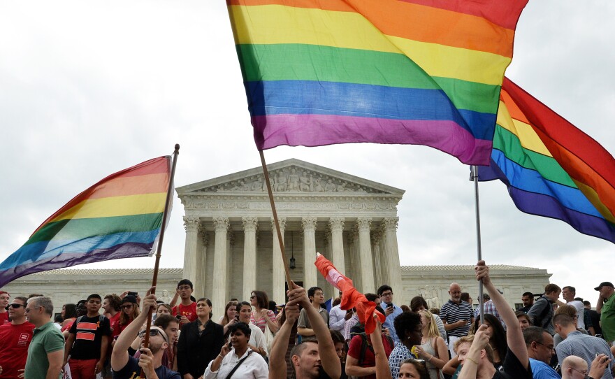 People celebrate outside the Supreme Court in Washington on June 26, 2015, after its historic decision on gay marriage.