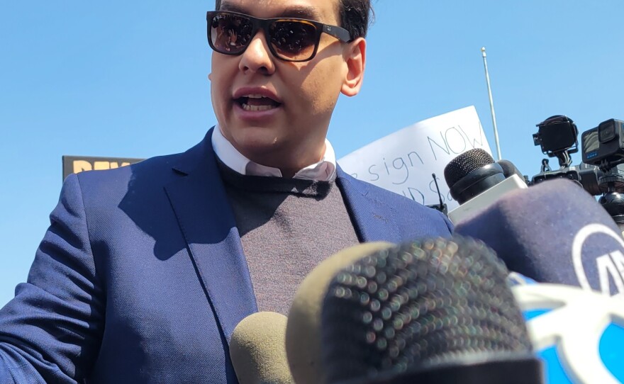 Rep. George Santos (R-NY3) speaking to reporters outside a federal courthouse on Long Island in May after he was charged with 13 federal crimes.