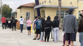 People waiting in line at City Heights Recreation Center to get tested for COVID-19, Dec. 23, 2021.