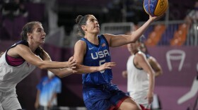 United States' Kelsey Plum (5) heads to the basket past Yulia Kozik, left, of the Russian Olympic Committee, during a women's 3-on-3 basketball game at the 2020 Summer Olympics, Sunday, July 25, 2021.