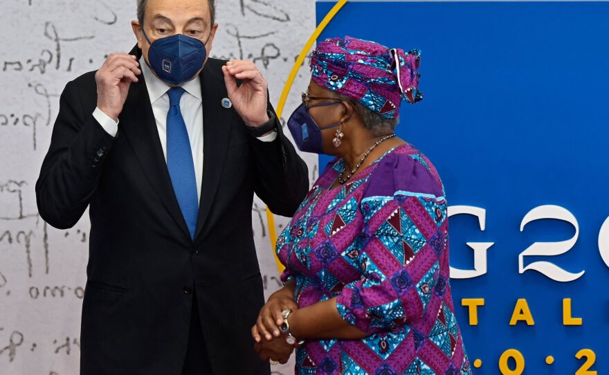 Italian Prime Minister Mario Draghi greets World Trade Organization Director-General Ngozi Okonjo-Iweala as she arrives for the G-20 summit.