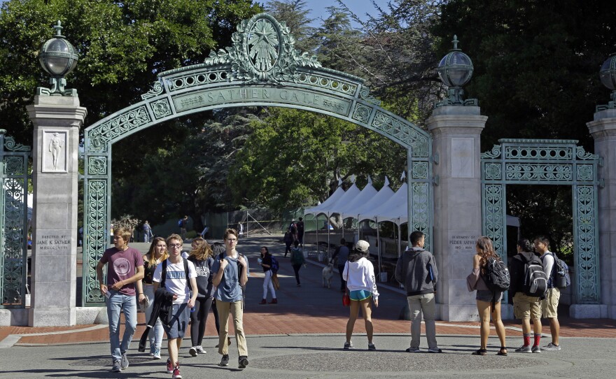 Students walk past Sather Gate on the University of California, Berkeley campus in Berkeley, Calif., April 21, 2017.