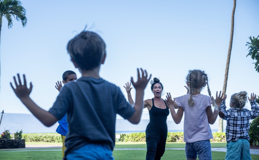 Kilihune Ka'aihue teaches a yoga class to children from Lahaina, many of whom lost their homes. Maui Arts and Cultural Center (MACC) Arts and Healing programming is held at the Royal Lahaina Resort where many displaced residents are temporarily staying.