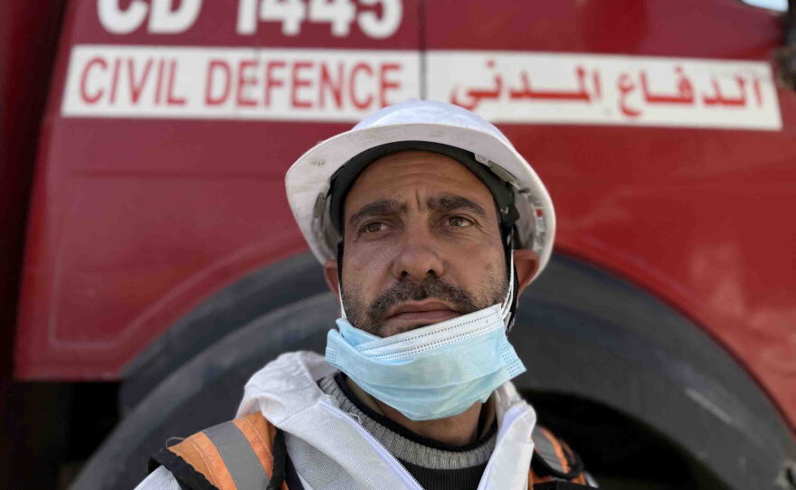 Mohammed Abdulrahman, 32, a member of the Gaza civil defense crew, poses for a portrait during a mission to recover the bodies of victims of the Abu Naser family from beneath the rubble of their destroyed apartment building.