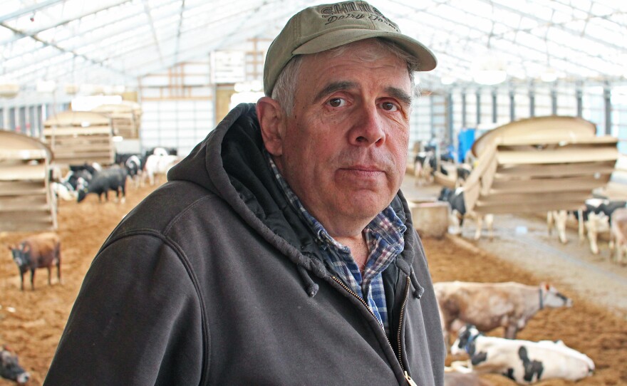 Bill Schuler stands in front of his cows on his <a href="http://www.shulerdairyfarms.com/">farm</a> in southwest Michigan.