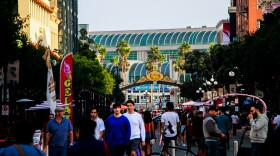 People walking the streets of the Gaslamp Quarter at 5:20pm, as Comic-Con closes its doors, Sunday, July 23, 2023. The international convention might be over, but the spirit of the event has not left the streets, animating each corner with cosplay displays and other activations still in place.