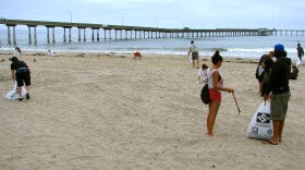 After city crews swept up Ocean Beach early in the morning, volunteers made sure things were spic and span.