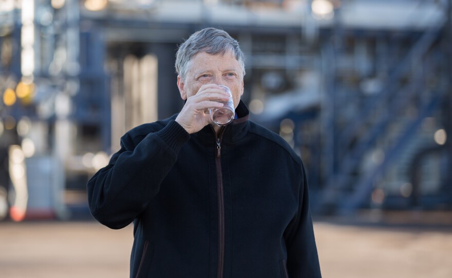 Bill Gates takes a sip of water that came out of the new Janicki Omniprocessor, which turns human waste into clean drinking water in minutes.