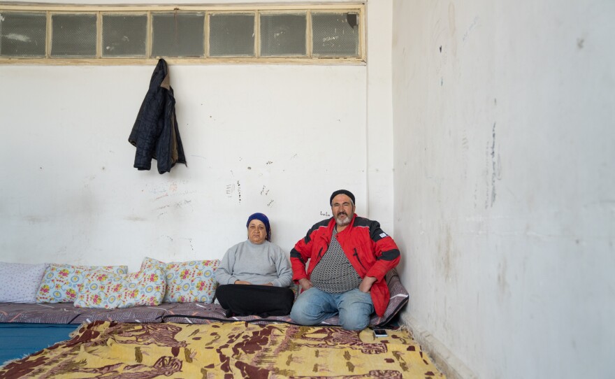 Sabah Hassan Biro (left) sits with her husband Said Mohammad Mustapha, 63 in the classroom where they are staying after being displaced from their home in Afrin.