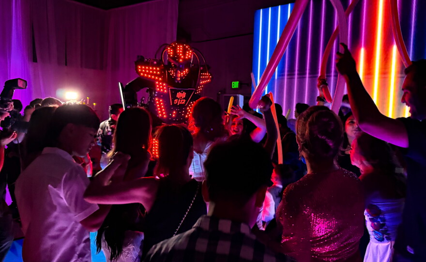 A robot is just one of three characters that joined the dance floor at Asiya Nero's quinceañera at Diamonds Event Hall.