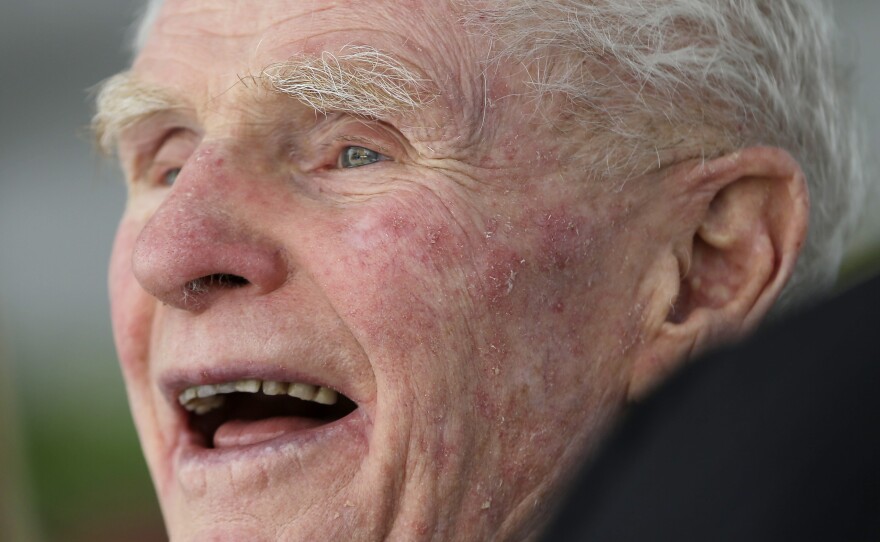 Former New Jersey Gov. Brendan Byrne laughs at a comment by New Jersey Speaker of the House Sheila Oliver during an event to unveil a statue of Byrne at the Essex County Courthouse, Thursday, in Oct. 2013, in Newark, N.J.