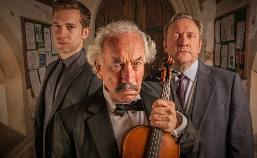 A scene from "The Curse of the Ninth" Barnaby and Winter uncover multiple motives when the winner of a fought-after music award is found strangled with a violin string, moments before a performance. The possible motives include rivalry over the prize, disagreements about the music festival business, and a missing Stradivarius violin.