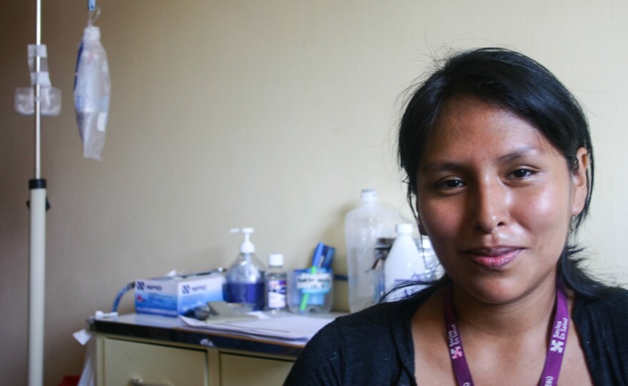 Diana Corolina Huamani Pasion is a TB nurse with Partners in Health in Lima, Peru. She'll greet a patient with a kiss on the cheek — levels of bacteria are very low after the drug regimen begins, she says.