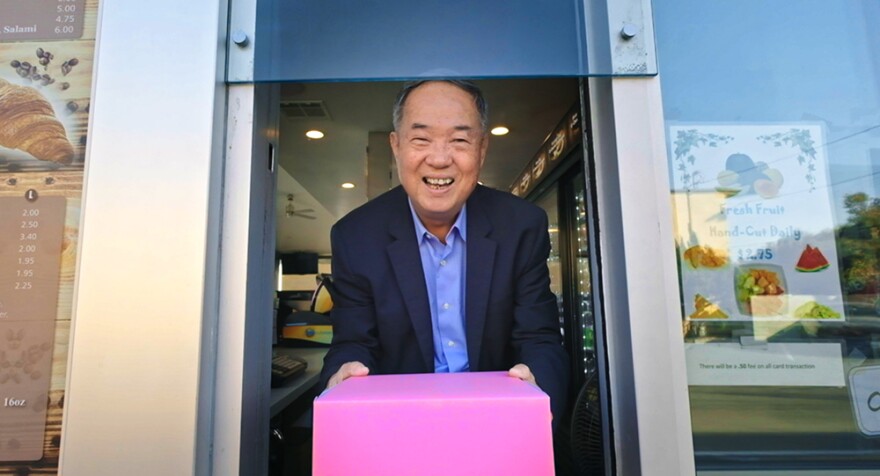 Ted Ngoy, The Donut King, at donut shop. 