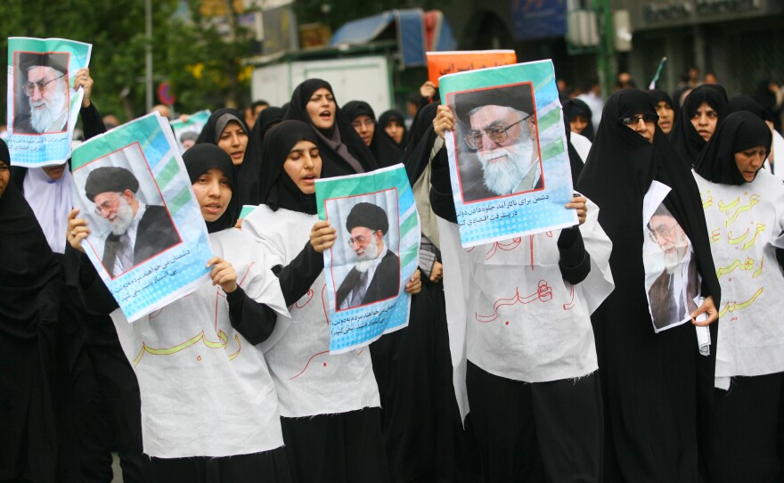 Supporters of Ayatollah Ali Khamenei parade his picture at Tehran University, on June 19, 2009 in Tehran, Iran. 