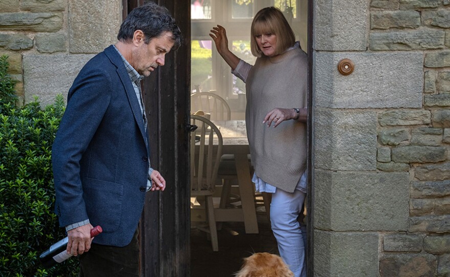 JOHN (Tony Gardner) and CAROLINE (Sarah Lancashire).