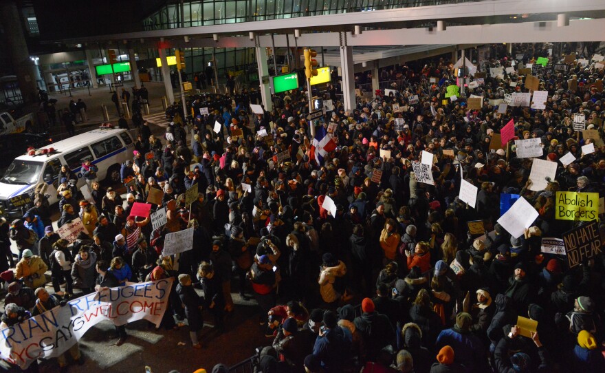 Thousands of protesters rally against the new immigration ban at John F. Kennedy International Airport in New York Saturday.