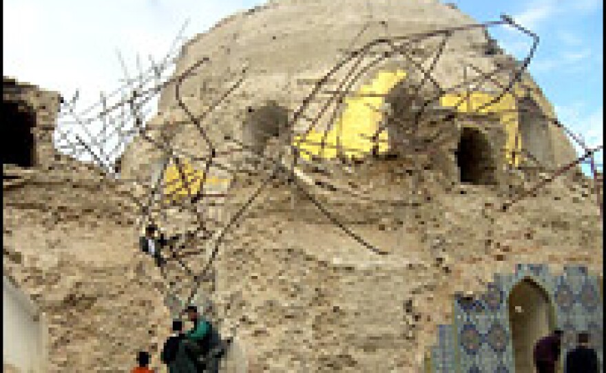 Iraqis inspect the bombed shrine in the northern Iraqi city of Samarra.