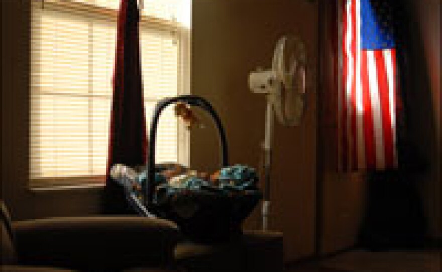 One of the couple's children sleeps in their home in Ozark, Mo.