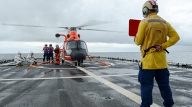 Crewmembers aboard the Coast Guard Cutter Stratton (WSML 752) fuel an embarked MH-65 Dolphin helicopter before a flight near the Bering Strait, July 10, 2018. 